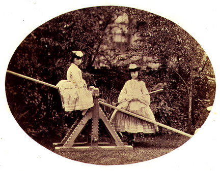 Liddell, Alice & Lorina on See-Saw (Lewis Carroll picture 1860)